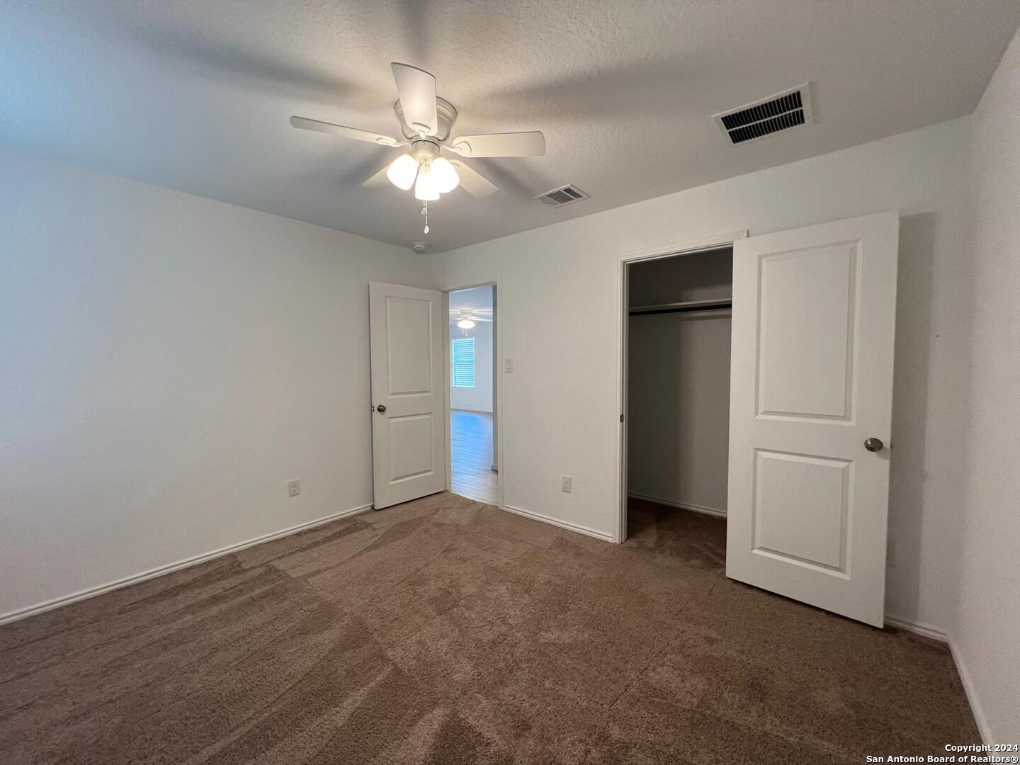 9928 Leeds Wheel San Antonio, TX 78254 - Photo 9 of 11 wooden floor in an empty room