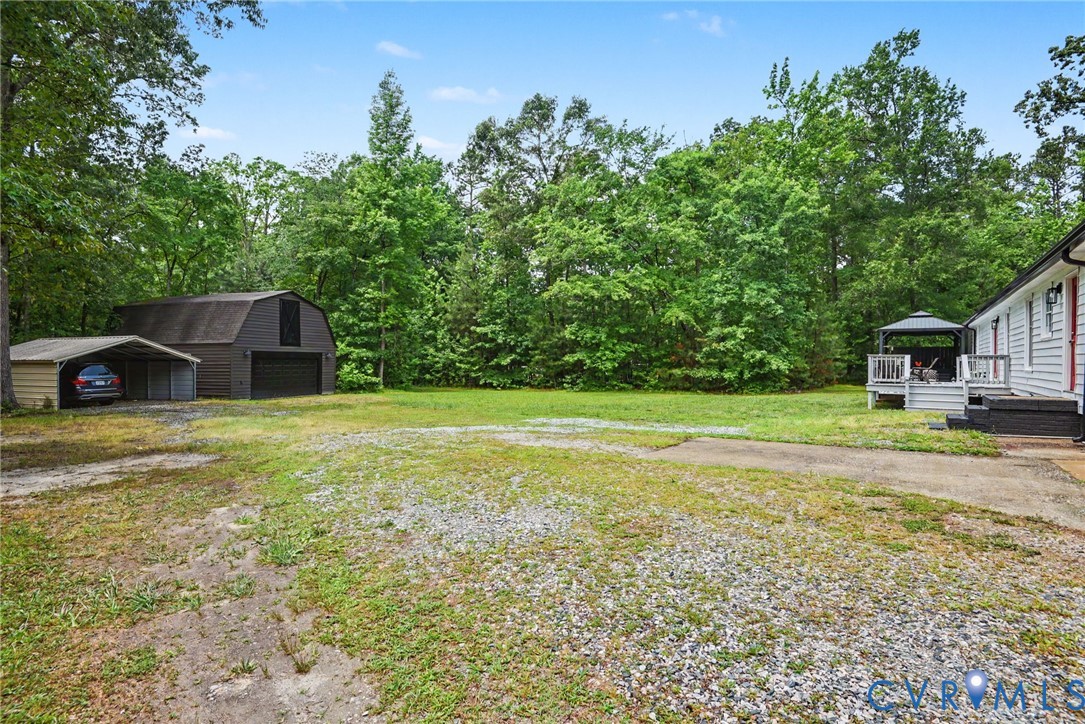 9820 Beaver Bridge Road Chesterfield, VA 23838 - Photo 50 of 54 Expansive outdoor area featuring a two-story barn,