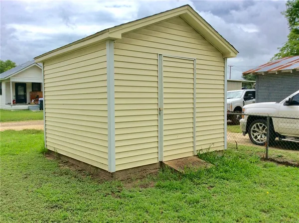 a view of a backyard with a garden