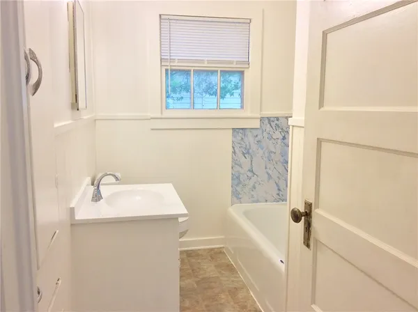 a bathroom with a sink and a bathtub