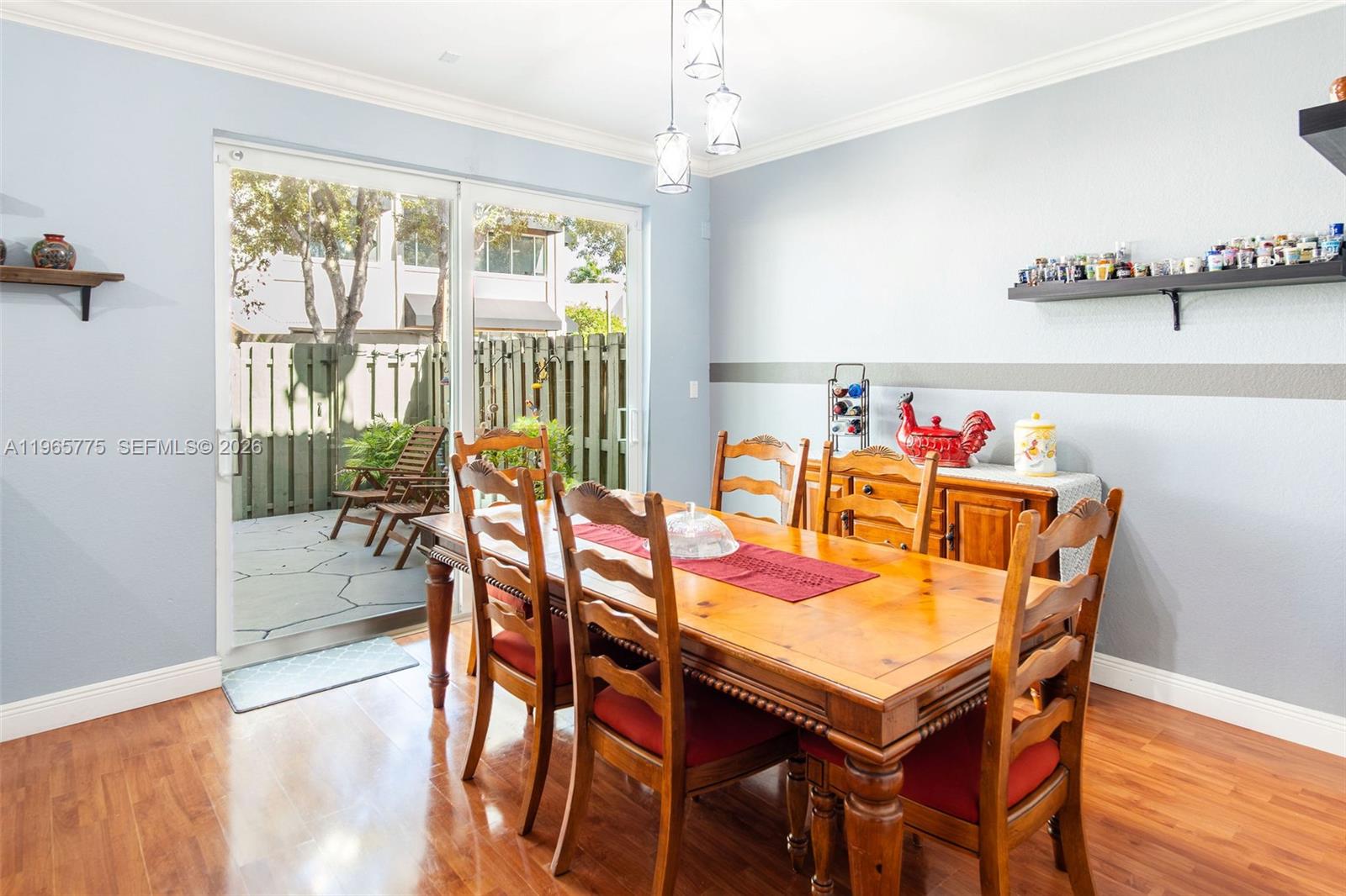 12523 Southwest 121st Way Miami, FL 33186 - Photo 20 of 56 a dining room with furniture a chandelier and wooden floor
