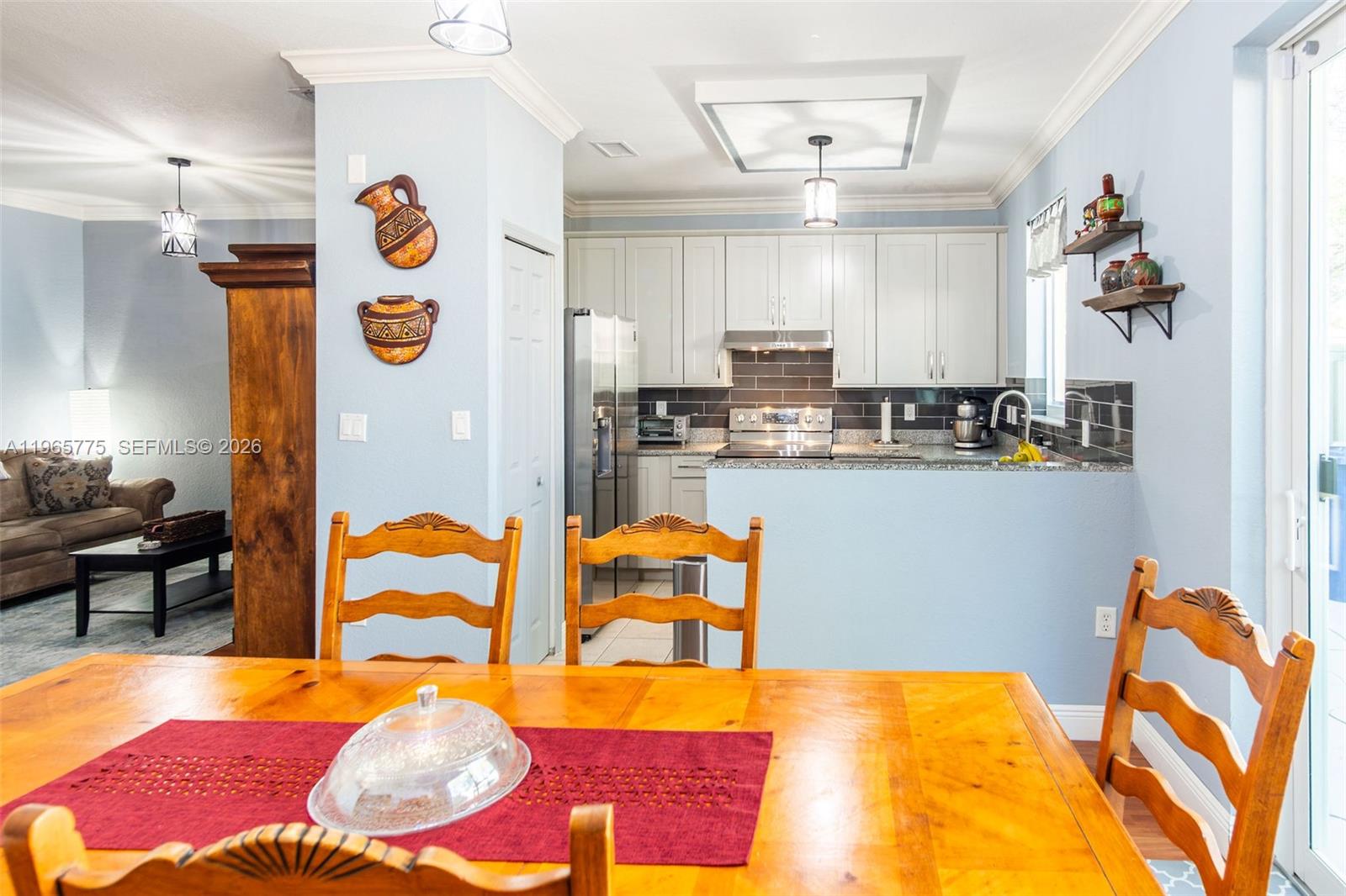 12523 Southwest 121st Way Miami, FL 33186 - Photo 23 of 56 a view of a kitchen and dining room