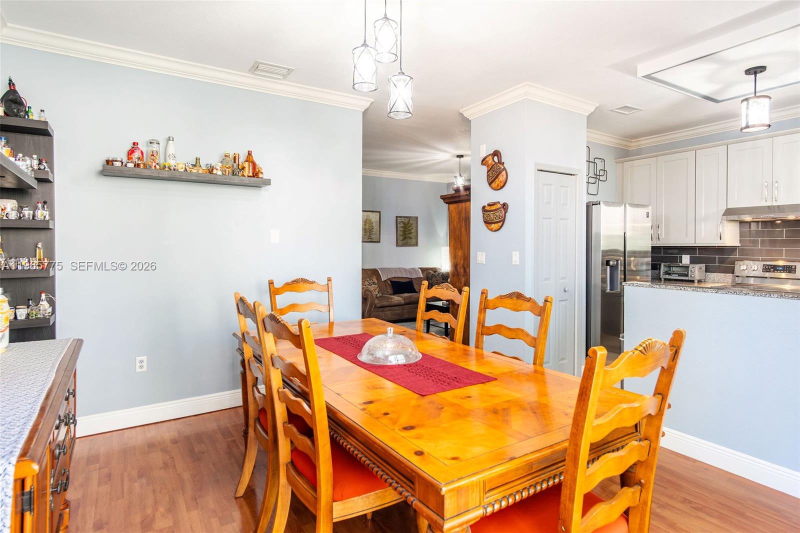12523 Southwest 121st Way Miami, FL 33186 - Photo 24 of 56 a dining room with furniture and wooden floor