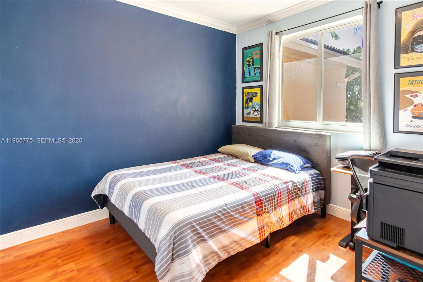 12523 Southwest 121st Way Miami, FL 33186 - Photo 27 of 56 a bedroom with a bed and a window