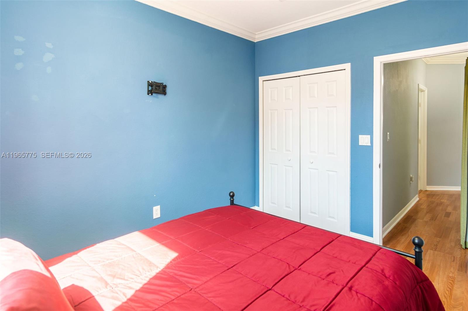 12523 Southwest 121st Way Miami, FL 33186 - Photo 33 of 56 a bed room with a bed and a closet