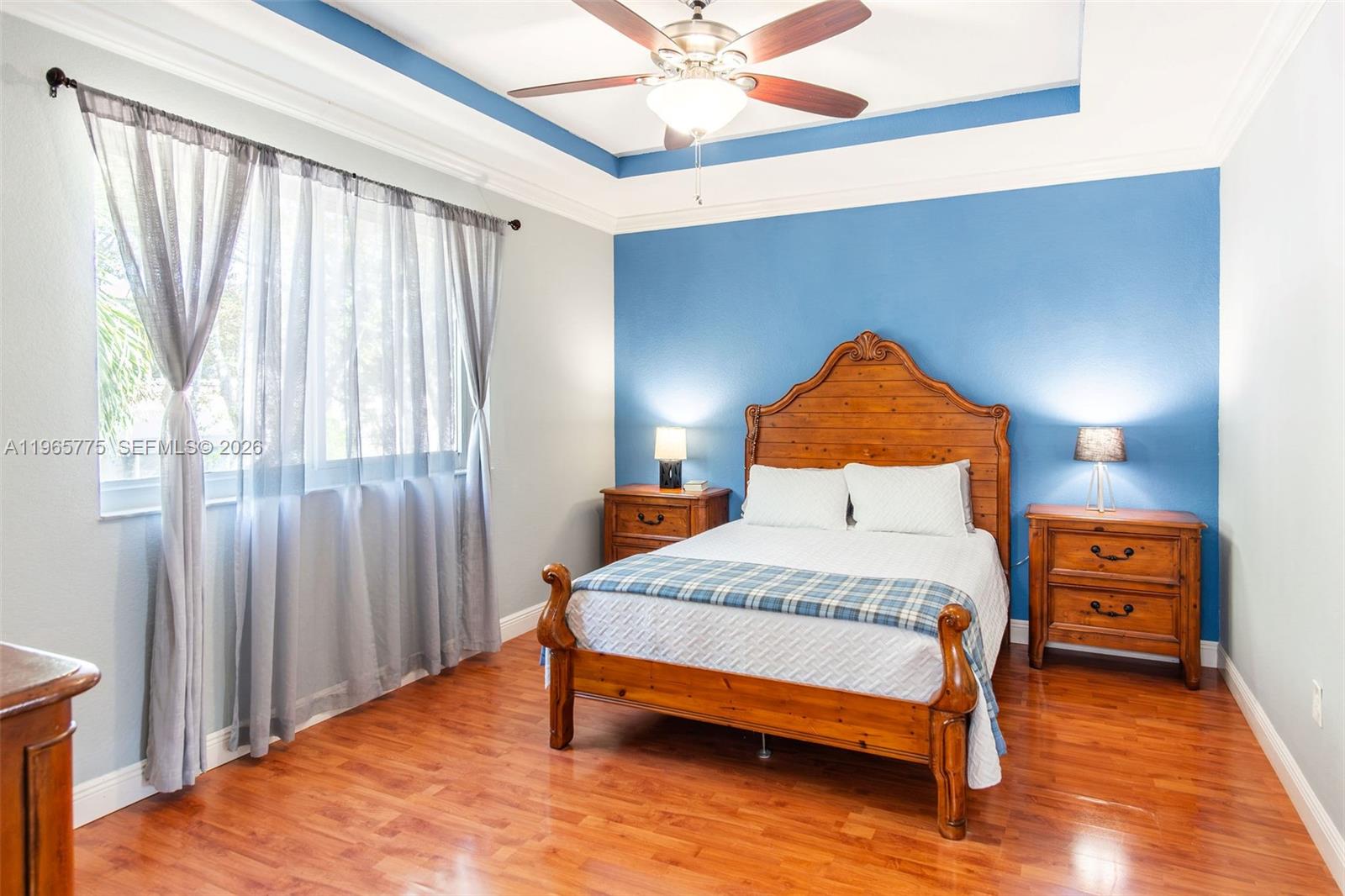 12523 Southwest 121st Way Miami, FL 33186 - Photo 36 of 56 a bedroom with a bed and window