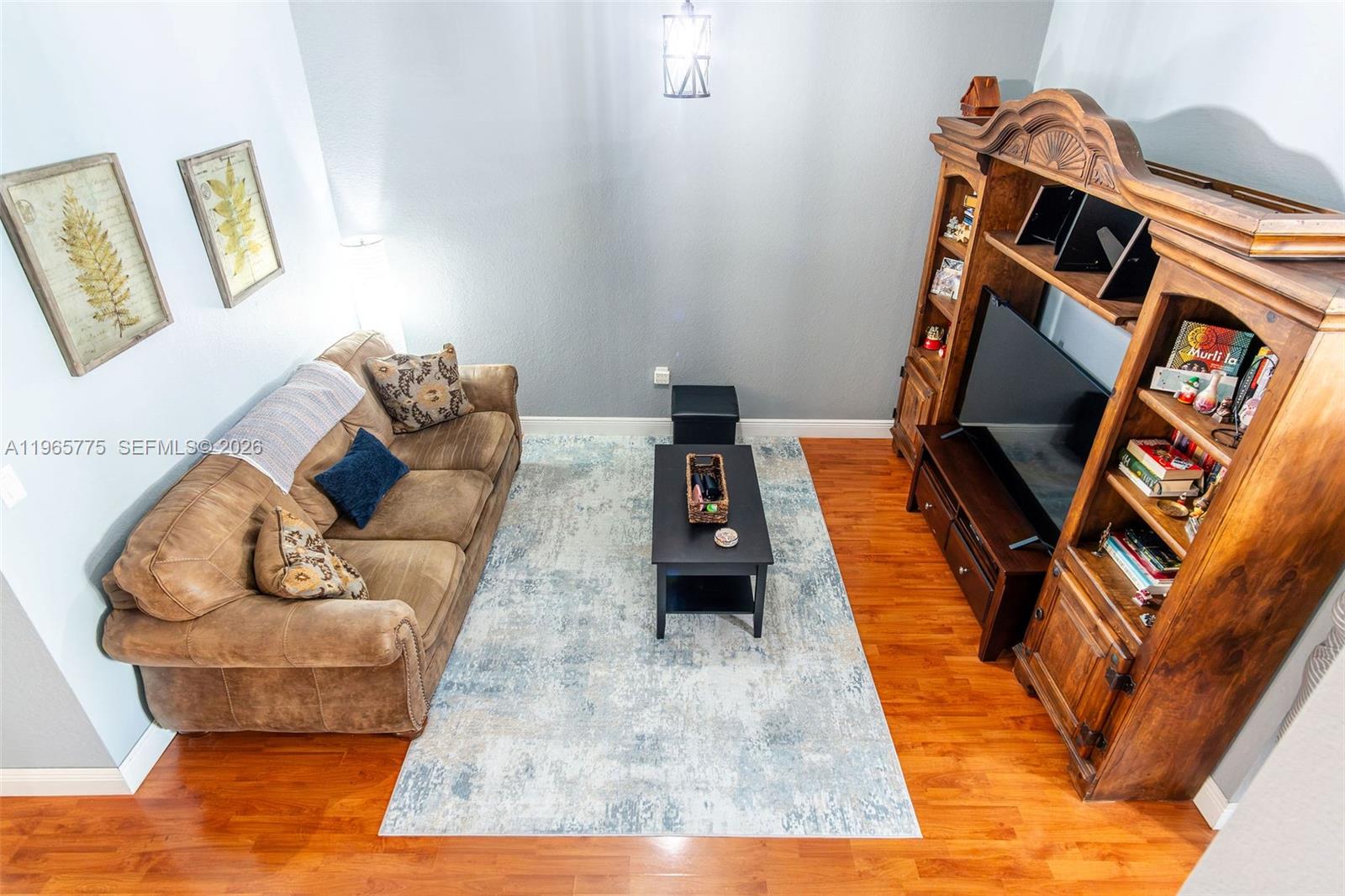 12523 Southwest 121st Way Miami, FL 33186 - Photo 46 of 56 a living room with furniture and a couch