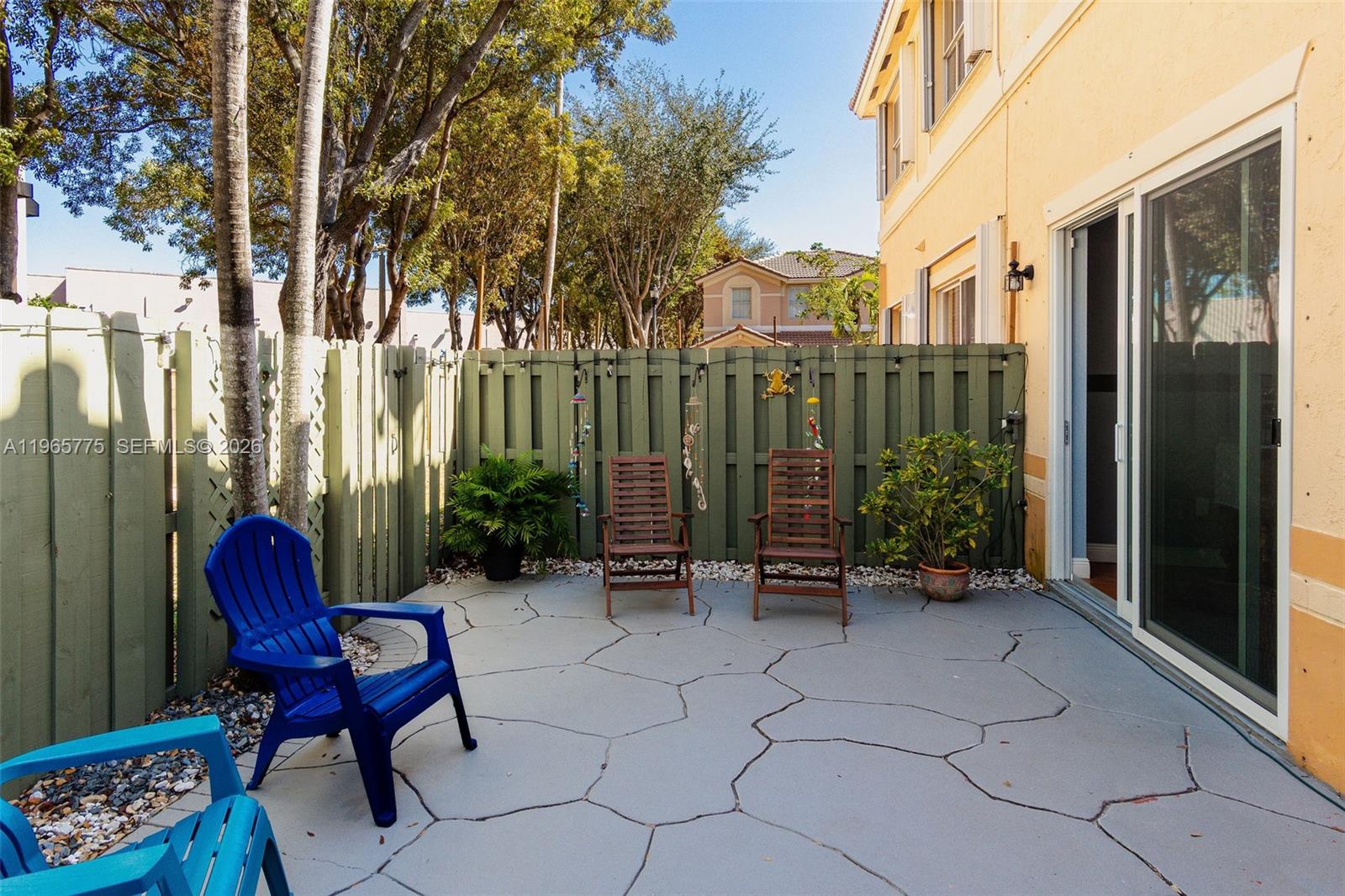 12523 Southwest 121st Way Miami, FL 33186 - Photo 48 of 56 a view of a chair and tables in the balcony