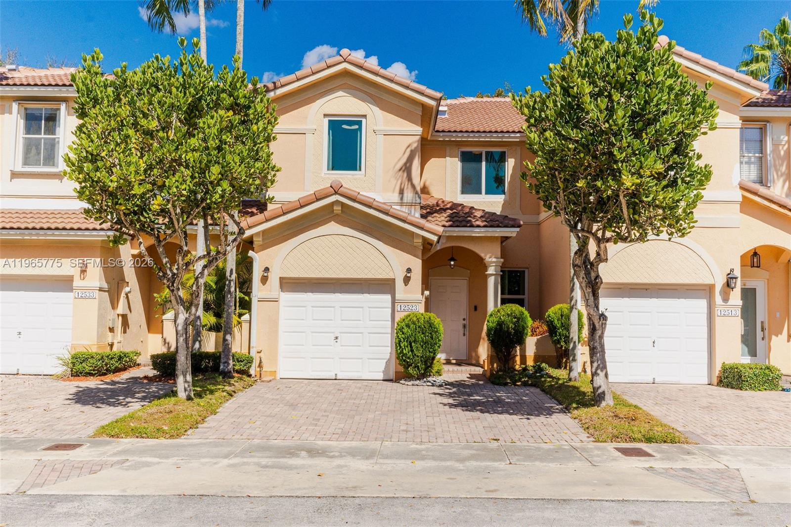 12523 Southwest 121st Way Miami, FL 33186 - Photo 51 of 56 a front view of a house with garden