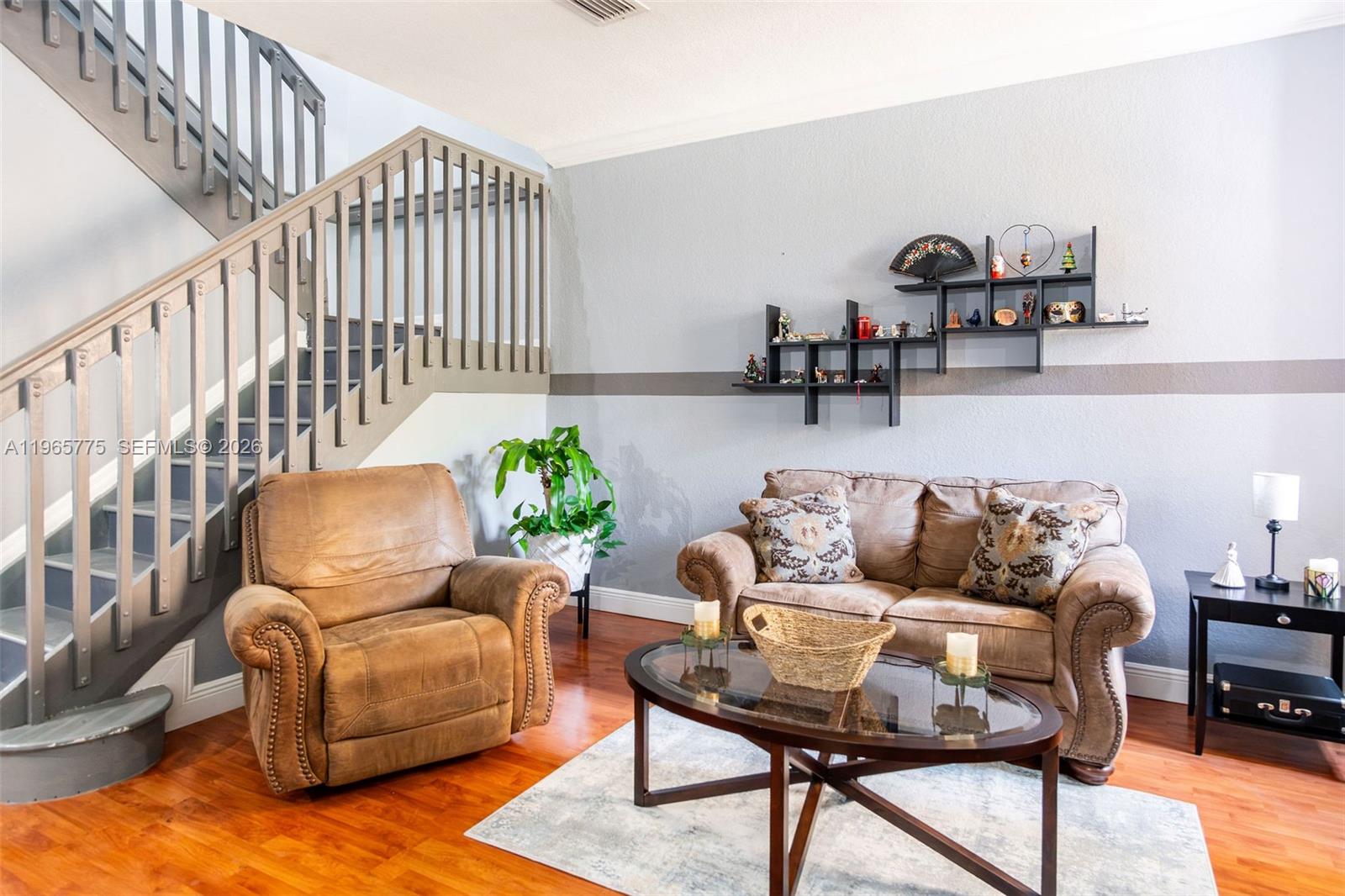 12523 Southwest 121st Way Miami, FL 33186 - Photo 6 of 56 a living room with furniture and a potted plant
