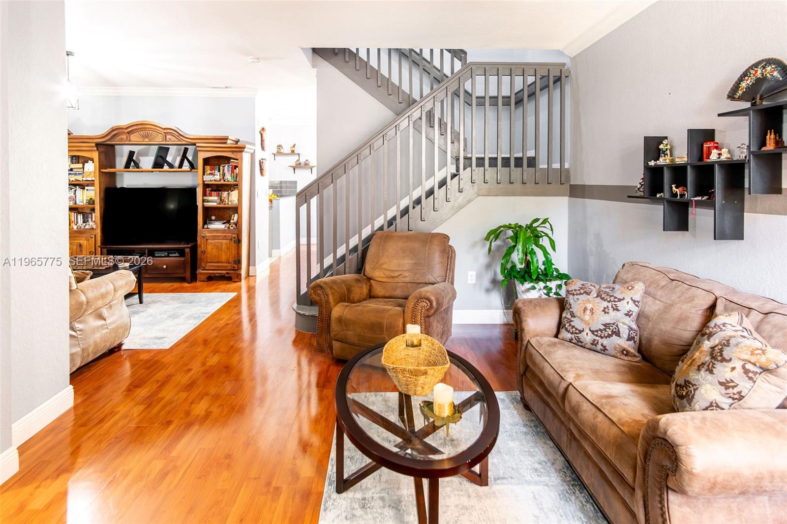 12523 Southwest 121st Way Miami, FL 33186 - Photo 7 of 56 a living room with furniture and a flat screen tv