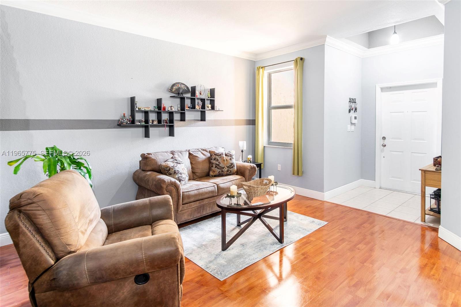 12523 Southwest 121st Way Miami, FL 33186 - Photo 9 of 56 a living room with furniture and a window