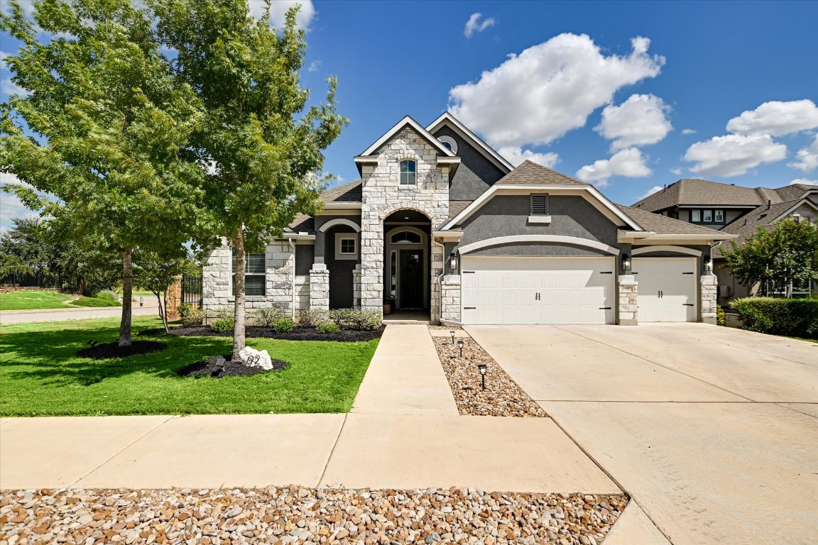 92 Rancho Trail Georgetown, TX 78628 - Photo 1 of 27 a front view of a house with garden