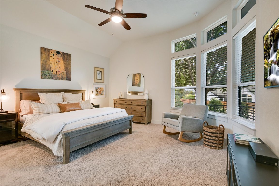 92 Rancho Trail Georgetown, TX 78628 - Photo 12 of 27 a spacious bedroom with a bed and a couch