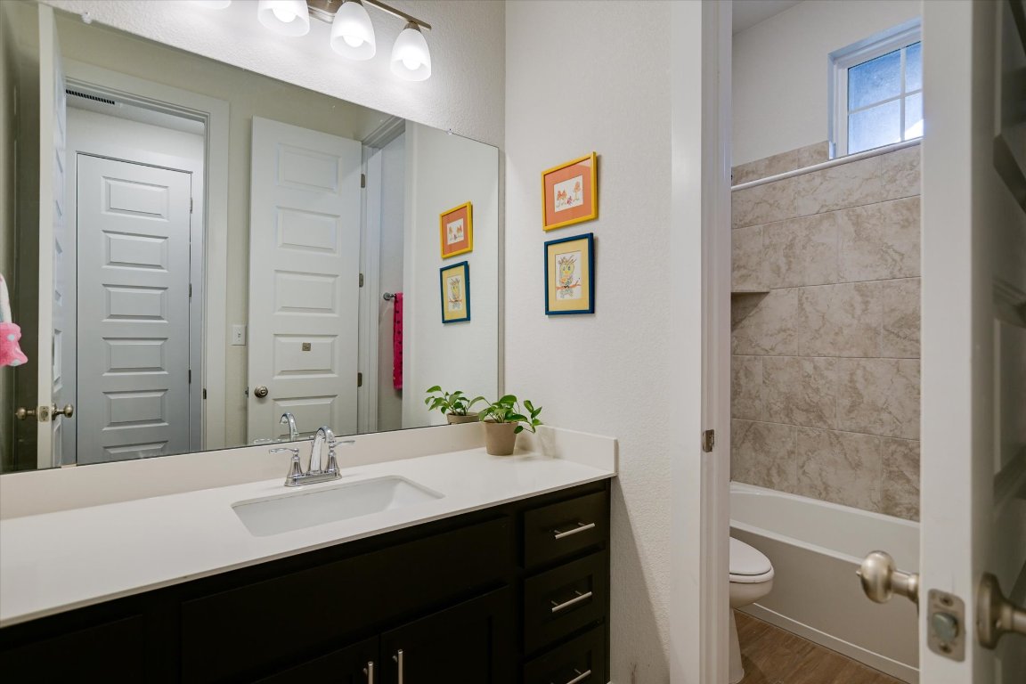 92 Rancho Trail Georgetown, TX 78628 - Photo 15 of 27 a bathroom with a sink and a mirror