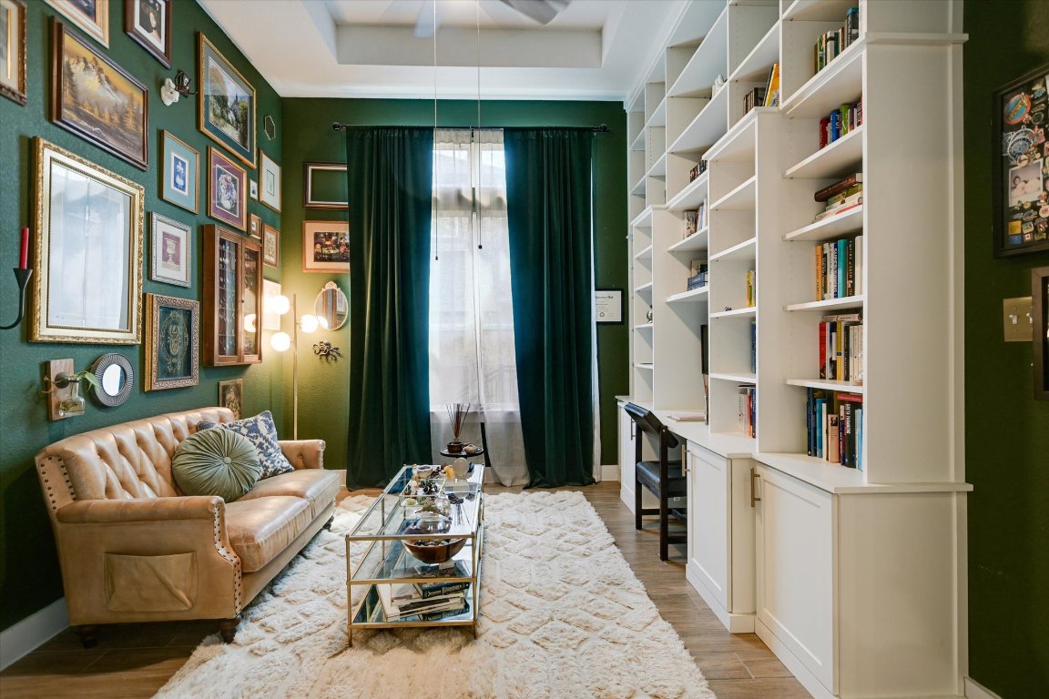 92 Rancho Trail Georgetown, TX 78628 - Photo 4 of 27 a balcony with furniture and a book shelf