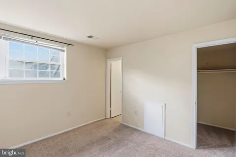 a view of an empty room with windows