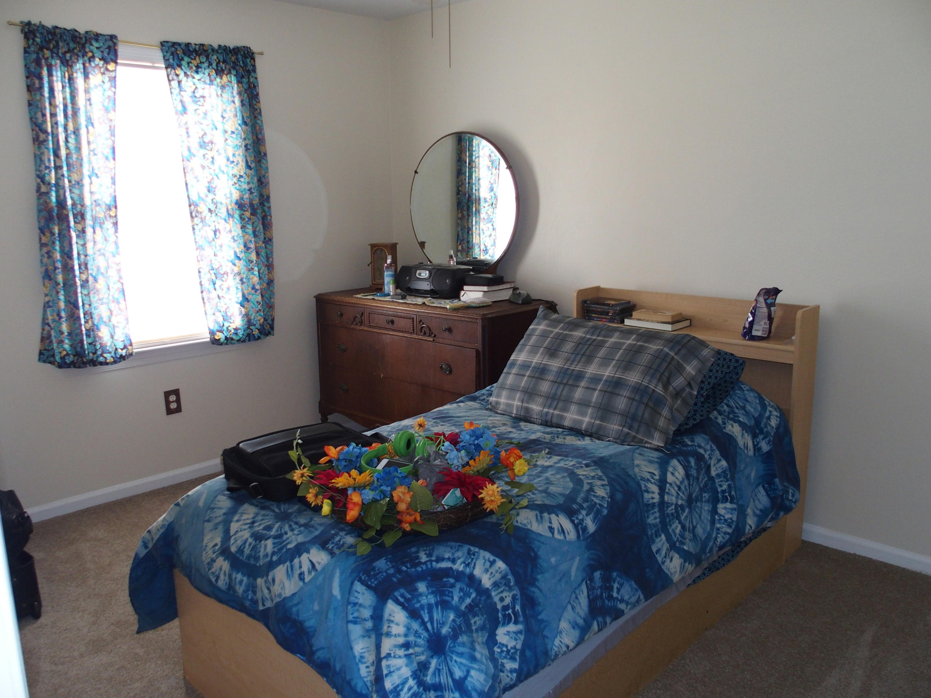 37 Cedarbrook Lane Blue Ridge, VA 24064 - Photo 13 of 21 a bed sitting in a bedroom next to a window