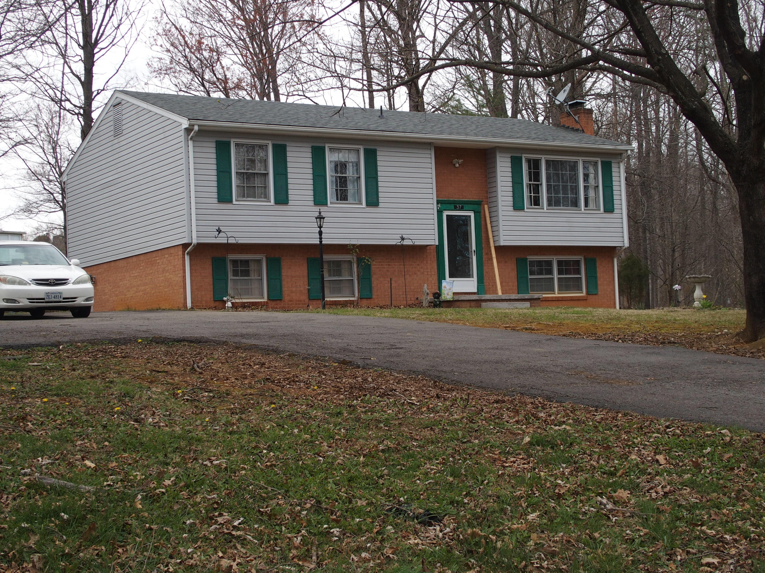 37 Cedarbrook Lane Blue Ridge, VA 24064 - Photo 2 of 21 a front view of a house with a garden