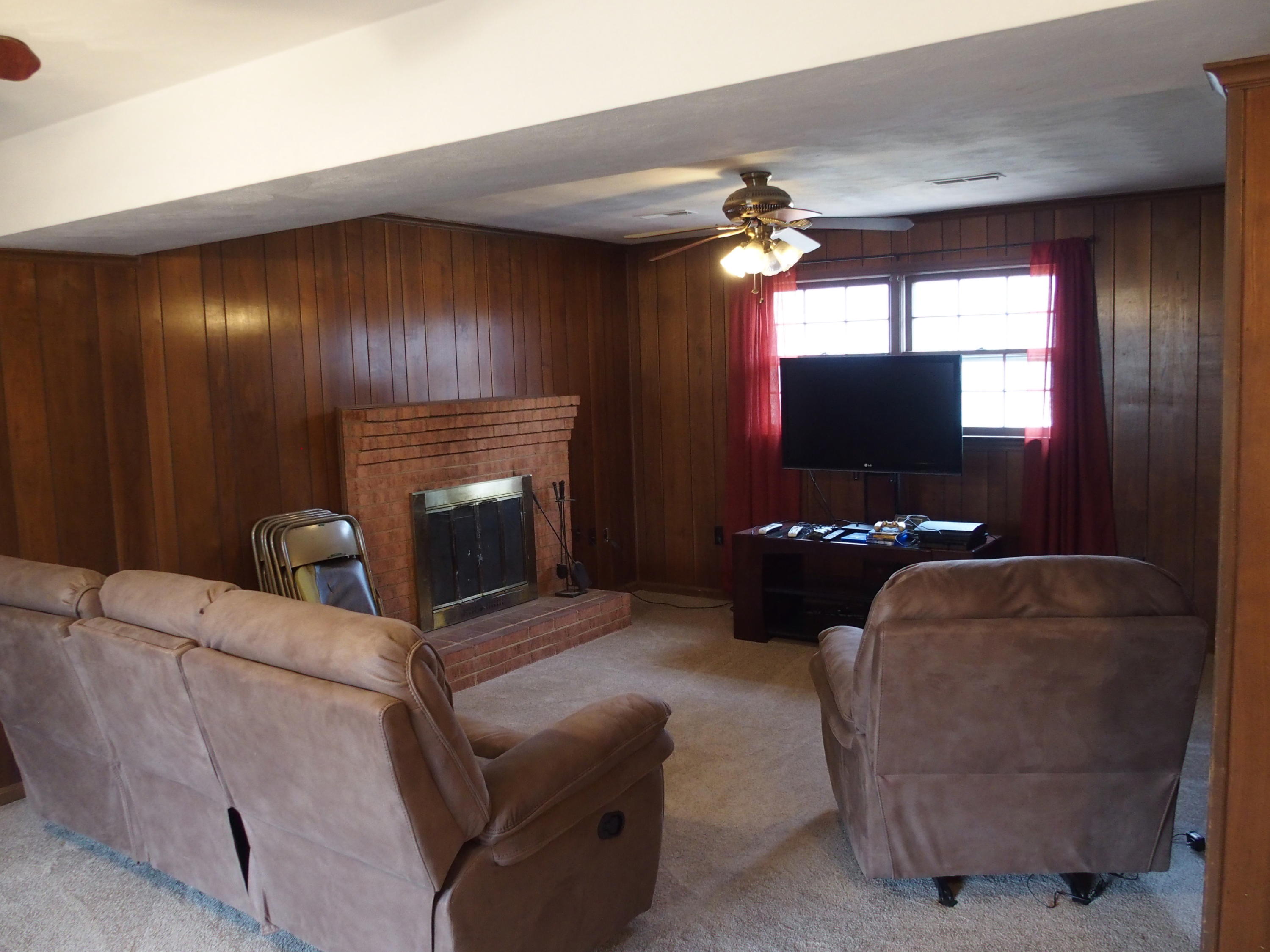 37 Cedarbrook Lane Blue Ridge, VA 24064 - Photo 3 of 21 a living room with furniture a flat screen tv and a fireplace