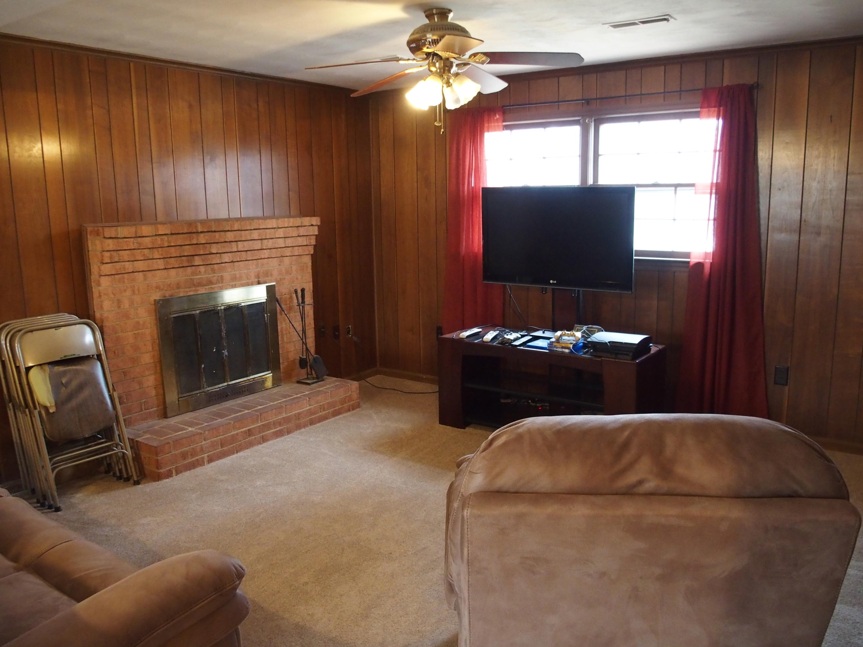 37 Cedarbrook Lane Blue Ridge, VA 24064 - Photo 4 of 21 a living room with furniture a flat screen tv and a fireplace
