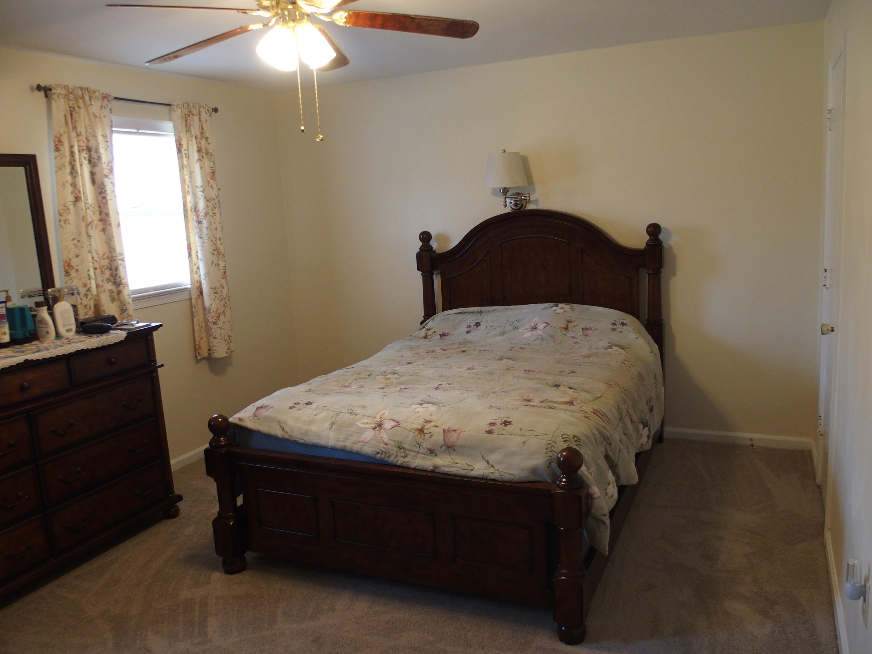 37 Cedarbrook Lane Blue Ridge, VA 24064 - Photo 6 of 21 a bed sitting in a bedroom next to a window