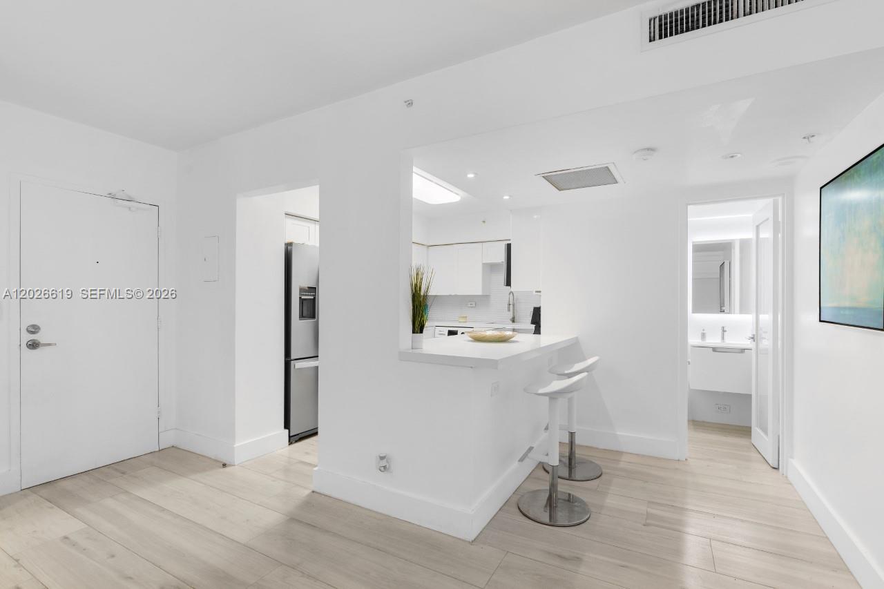 1500 Bay Road, Unit 1268S Miami Beach, FL 33139 - Photo 18 of 31 a view of kitchen with sink and refrigerator