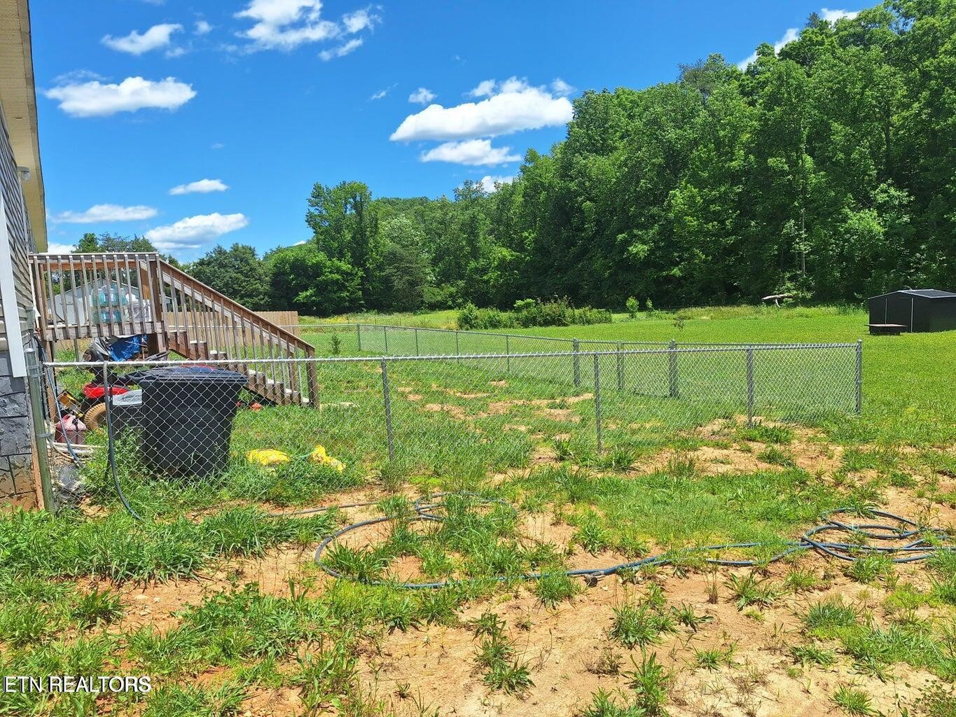 1450 Belltown Road Tellico Plains, TN 37385 - Photo 5 of 32 a view of a house with a big yard