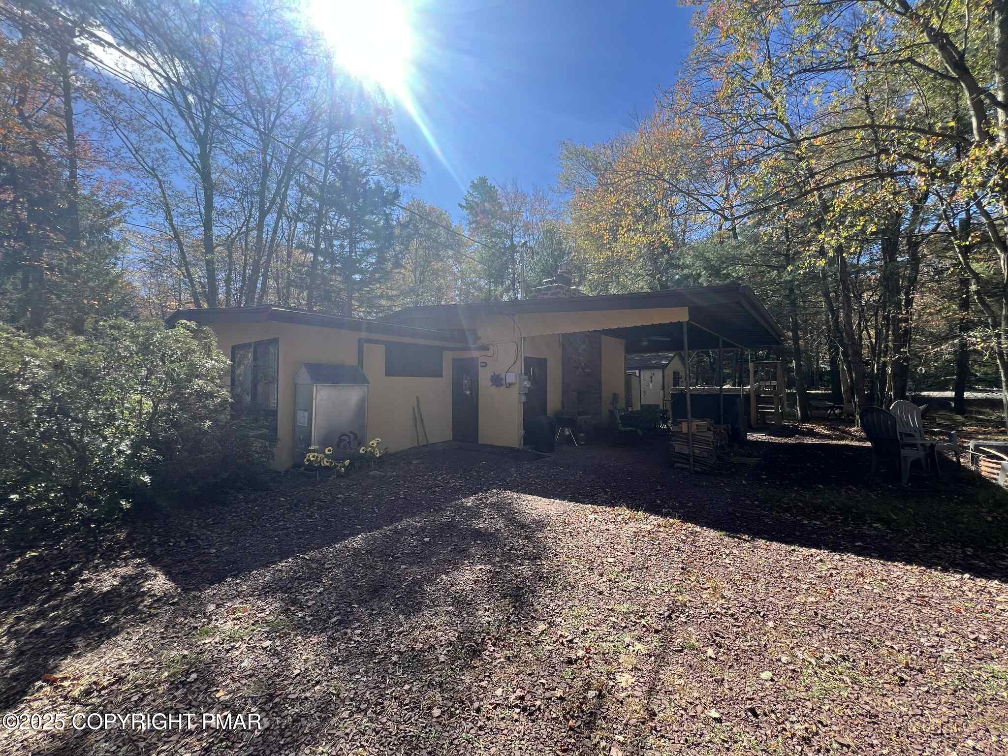 25 Red Oak Road Lake Harmony, PA 18624 - Photo 1 of 23 a front view of a house with a yard and garage