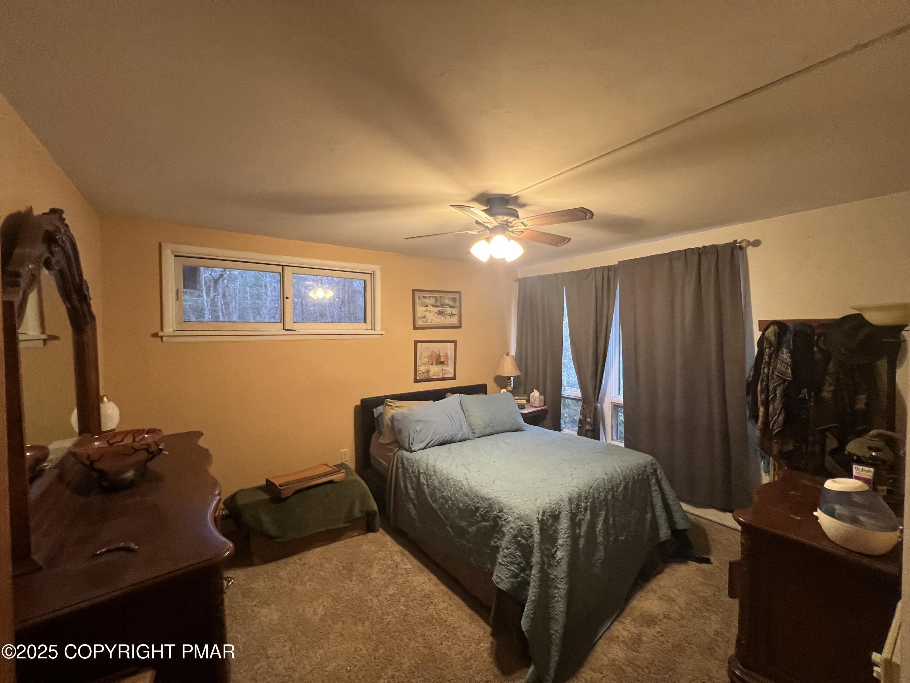 25 Red Oak Road Lake Harmony, PA 18624 - Photo 12 of 23 a bedroom with a bed dresser and a window