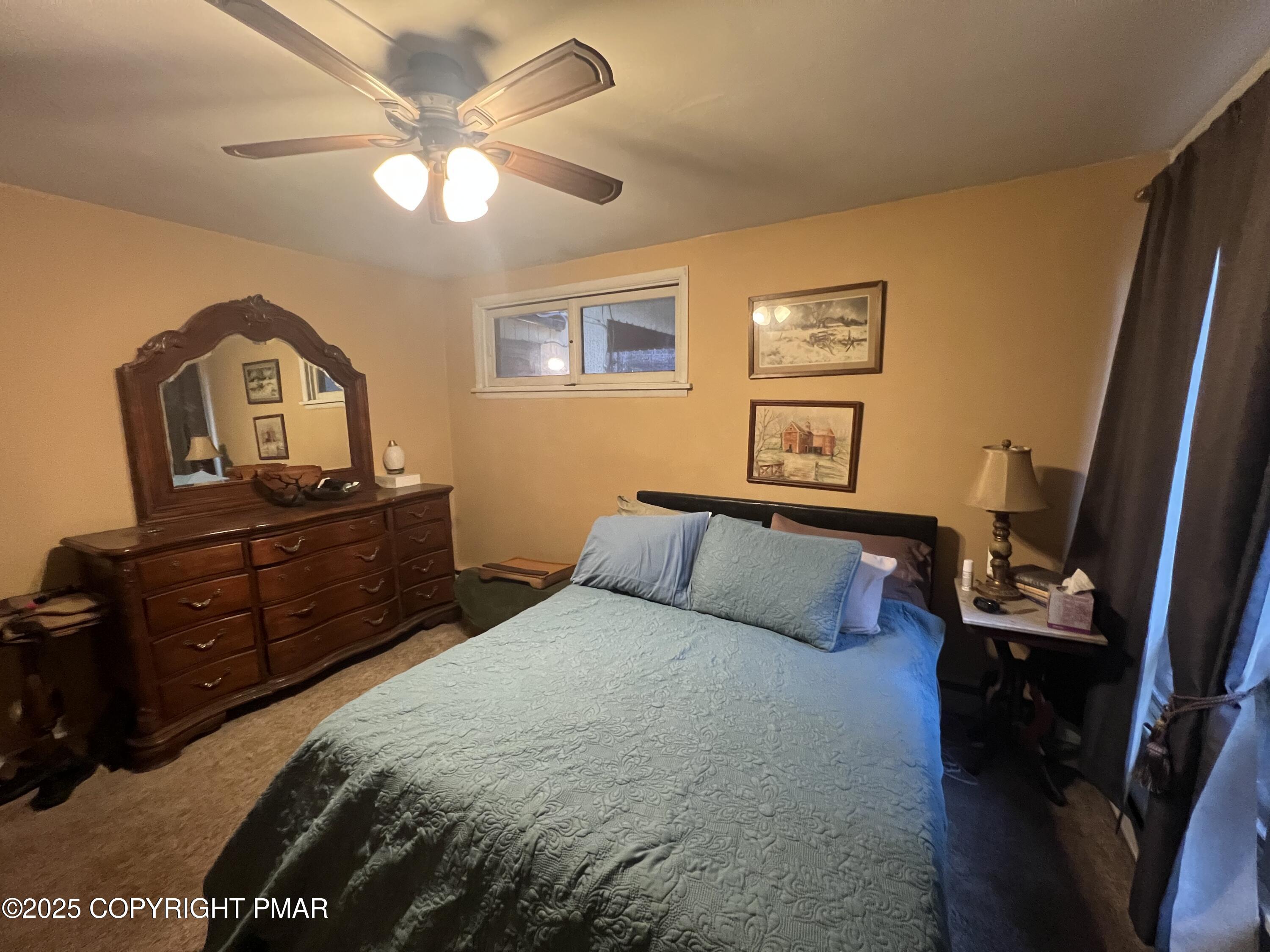 25 Red Oak Road Lake Harmony, PA 18624 - Photo 13 of 23 a bedroom with a bed and wooden floor
