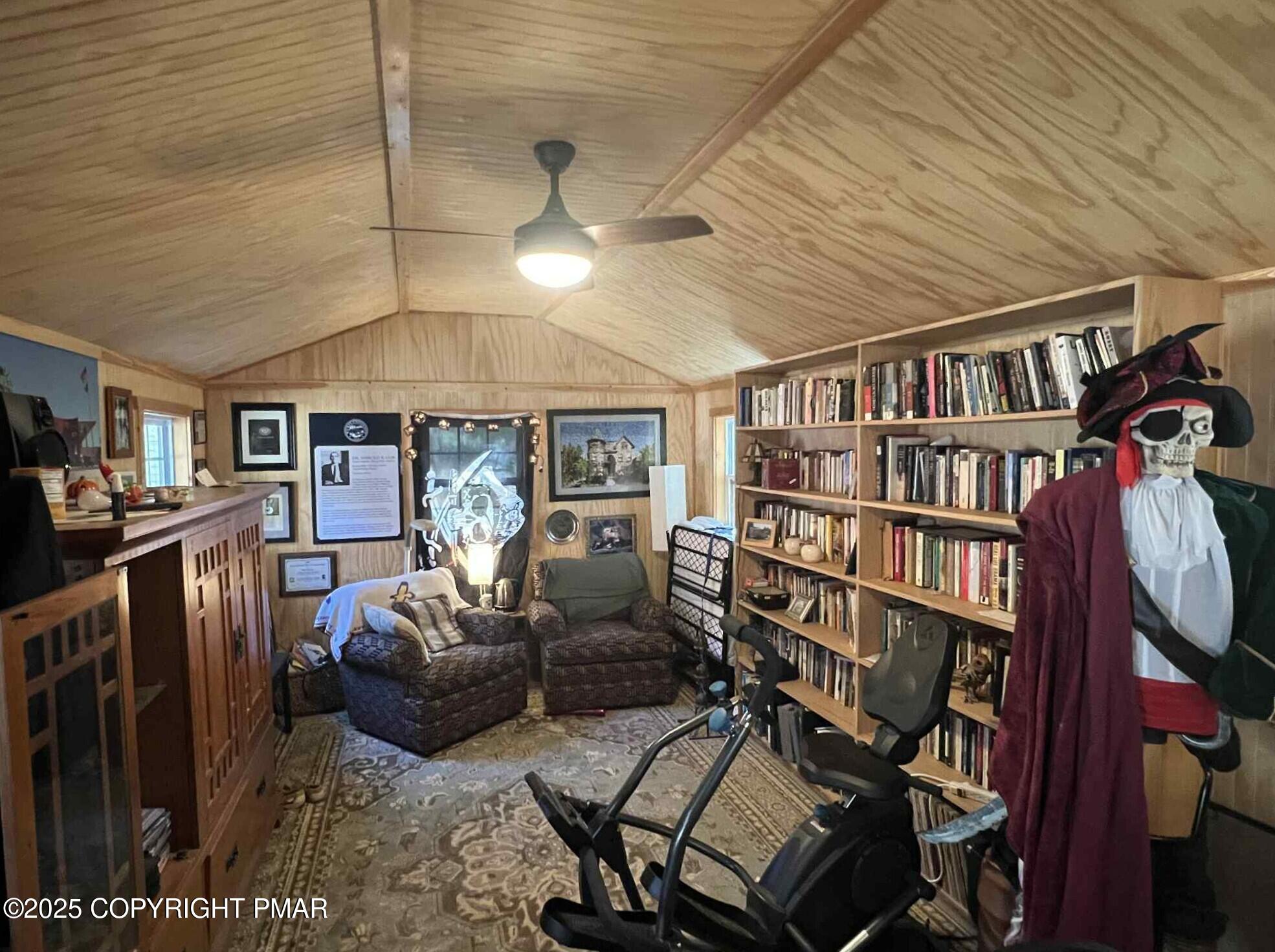 25 Red Oak Road Lake Harmony, PA 18624 - Photo 15 of 23 a living room with furniture a rug and a book shelf