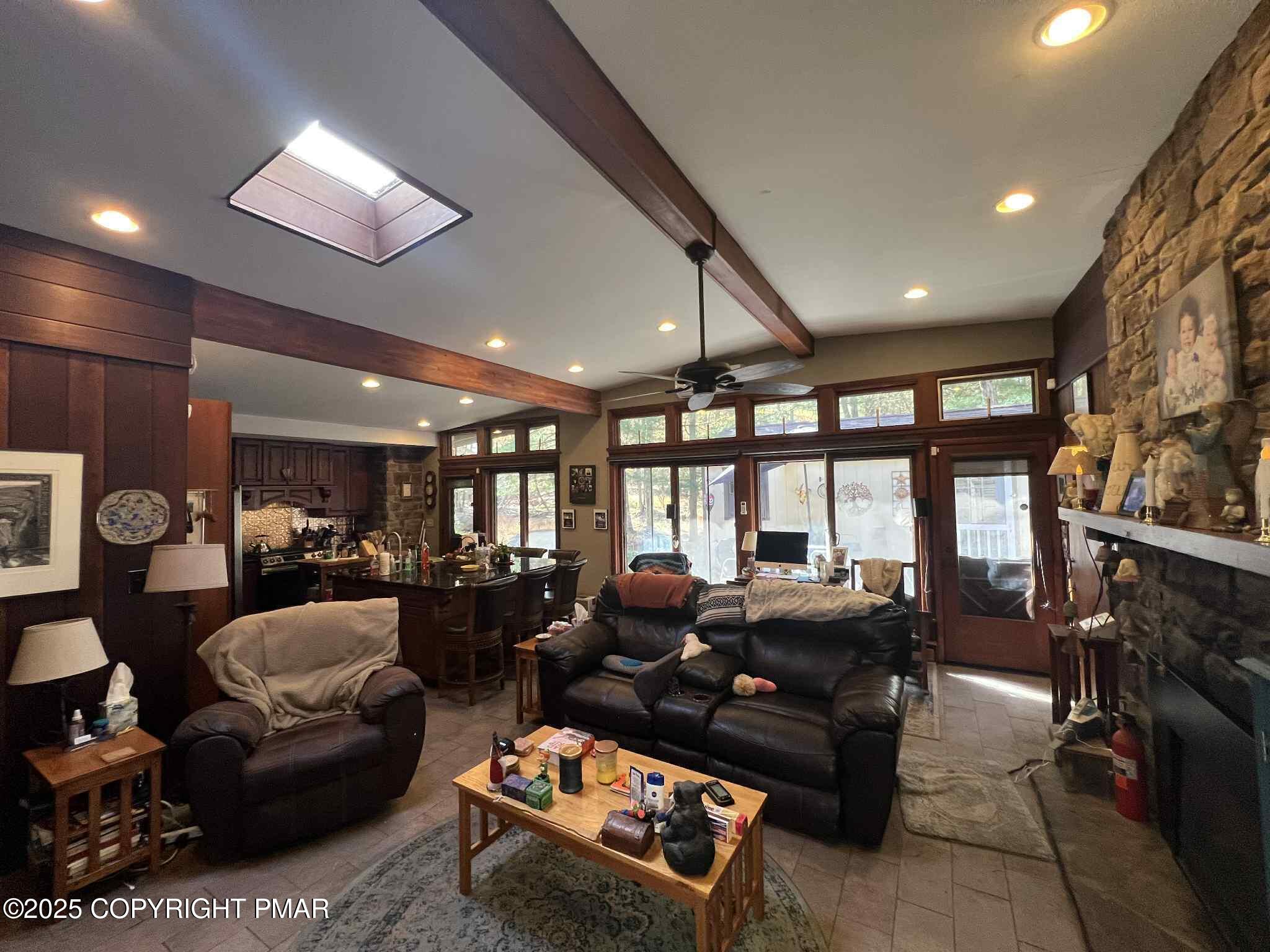 25 Red Oak Road Lake Harmony, PA 18624 - Photo 4 of 23 a living room with furniture a large window and a flat screen tv