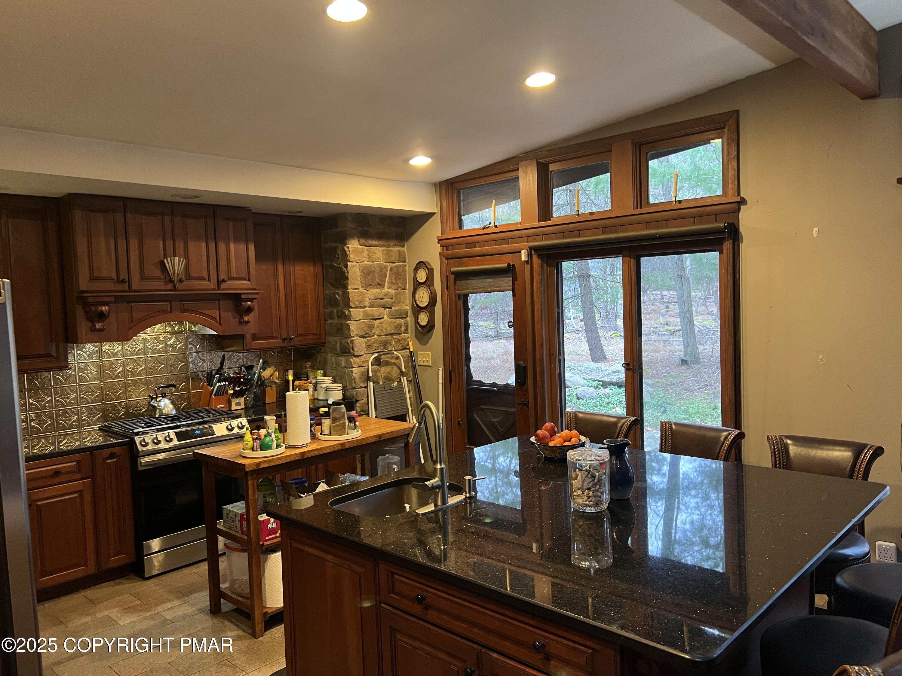25 Red Oak Road Lake Harmony, PA 18624 - Photo 7 of 23 a kitchen counter top space a sink a stove and a refrigerator