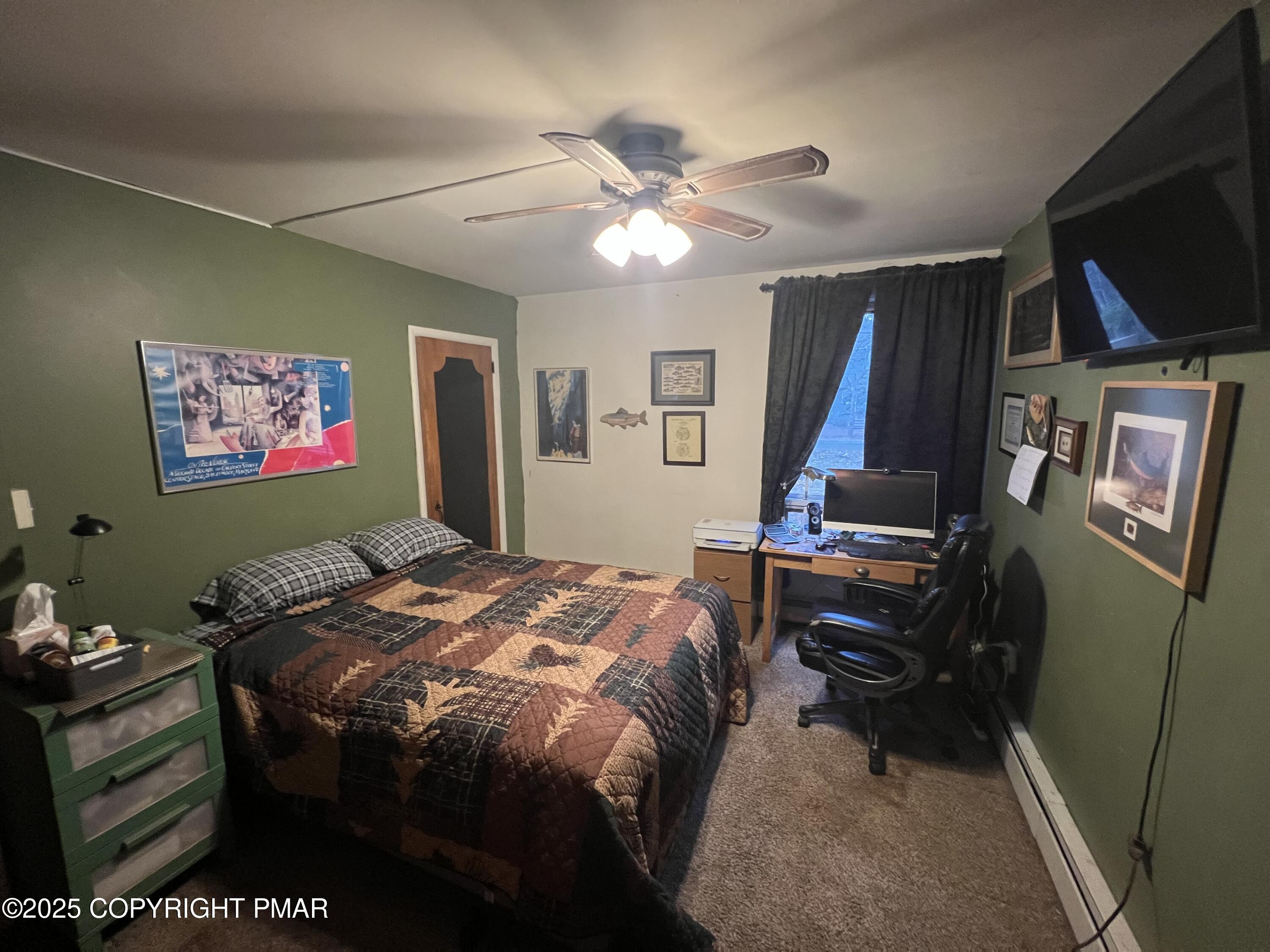 25 Red Oak Road Lake Harmony, PA 18624 - Photo 9 of 23 a bedroom with a bed and a flat screen tv