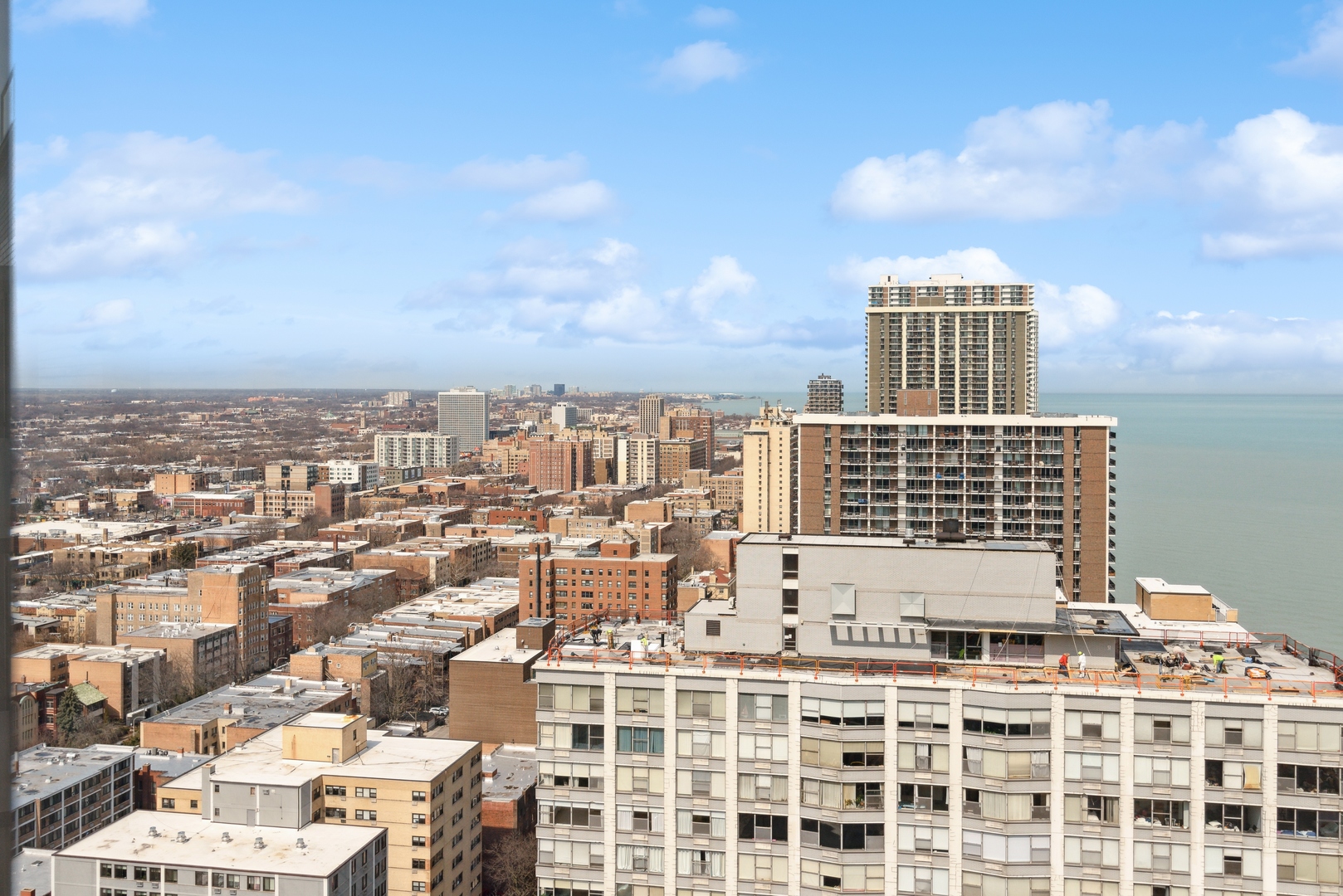 5701 North Sheridan Road, Unit 30D Chicago, IL 60660 - Photo 6 of 16 a view of a city with tall buildings