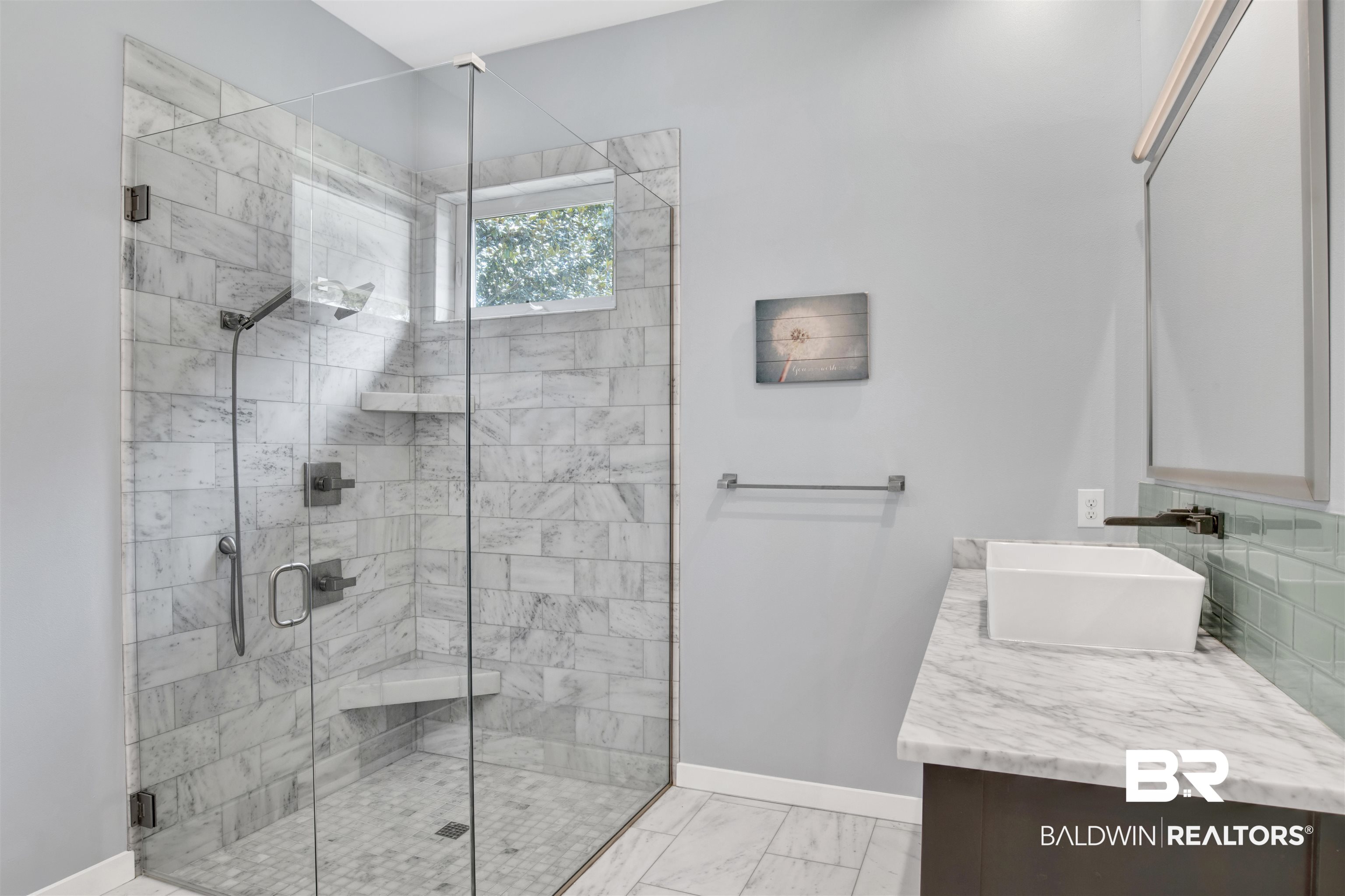 27980 Canal Road Orange Beach, AL 36561 - Photo 32 of 46 Bathroom with vanity, a shower stall, and marble look tiles