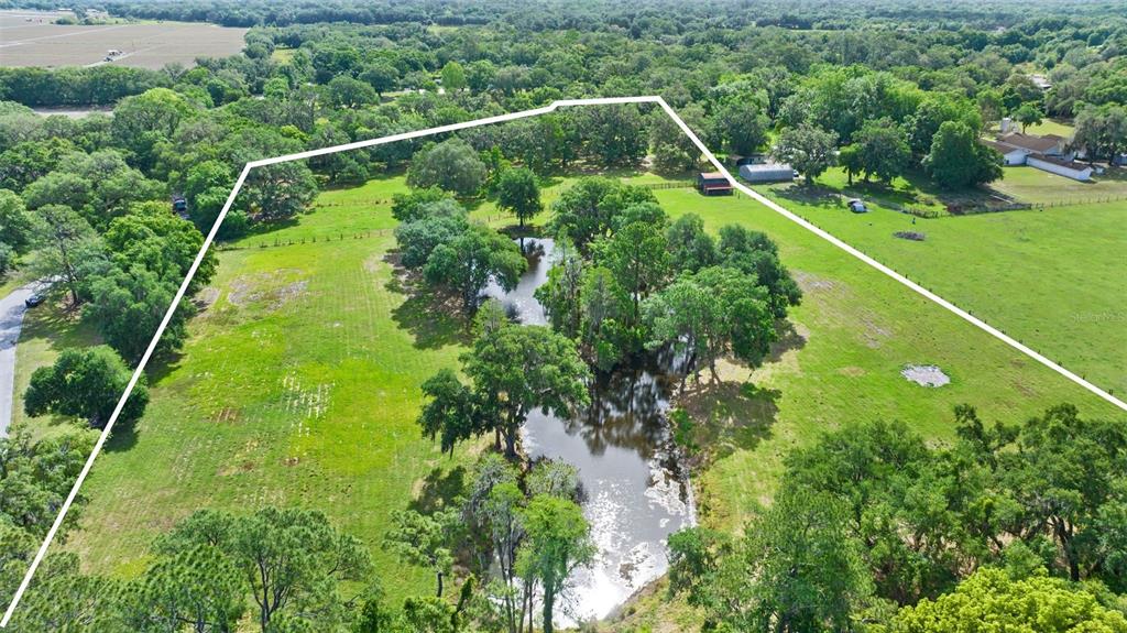 McIntosh Road Thonotosassa, FL 33592 - Photo 1 of 1 This image is facing McIntosh Road towards the top of the image. To the left is the Stonelake Ranch McIntosh Entrance.