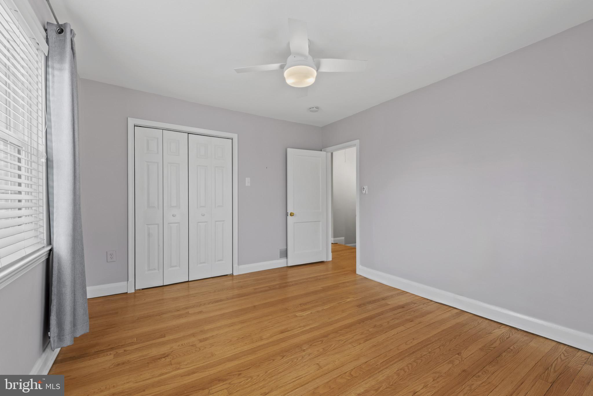 169 Regester Avenue Baltimore, MD 21212 - Photo 11 of 30 Bright and airy room with hardwood floors.