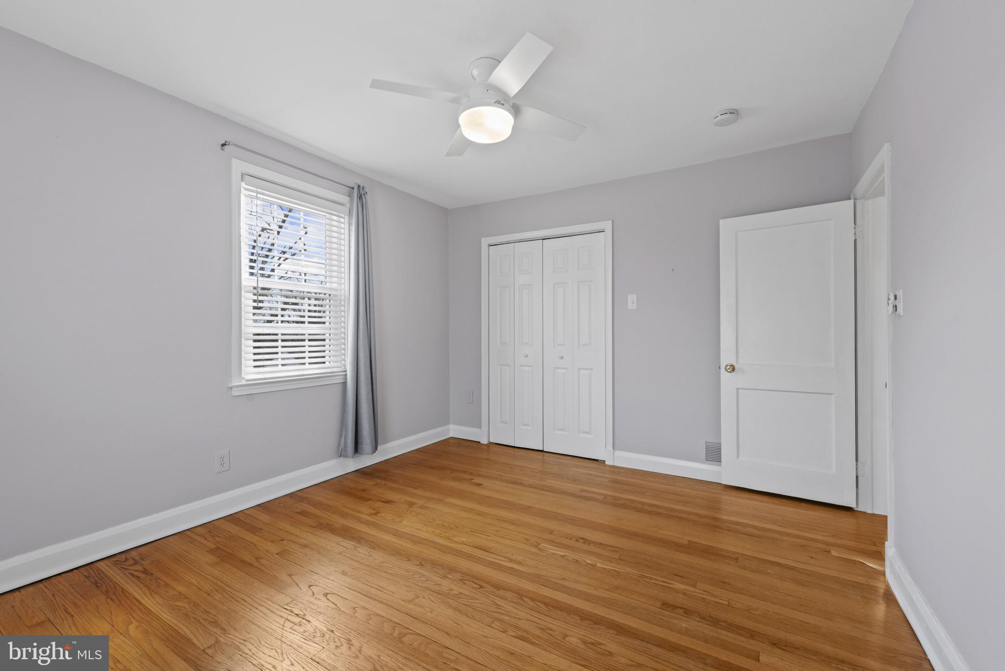169 Regester Avenue Baltimore, MD 21212 - Photo 12 of 30 Bright and airy room with hardwood floors.