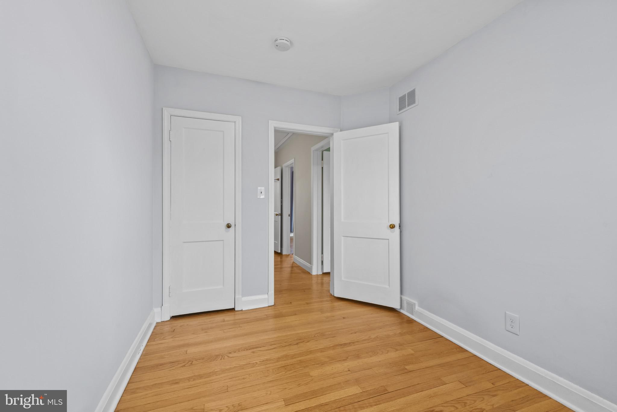 169 Regester Avenue Baltimore, MD 21212 - Photo 16 of 30 Bright and airy hallway with classic doors.