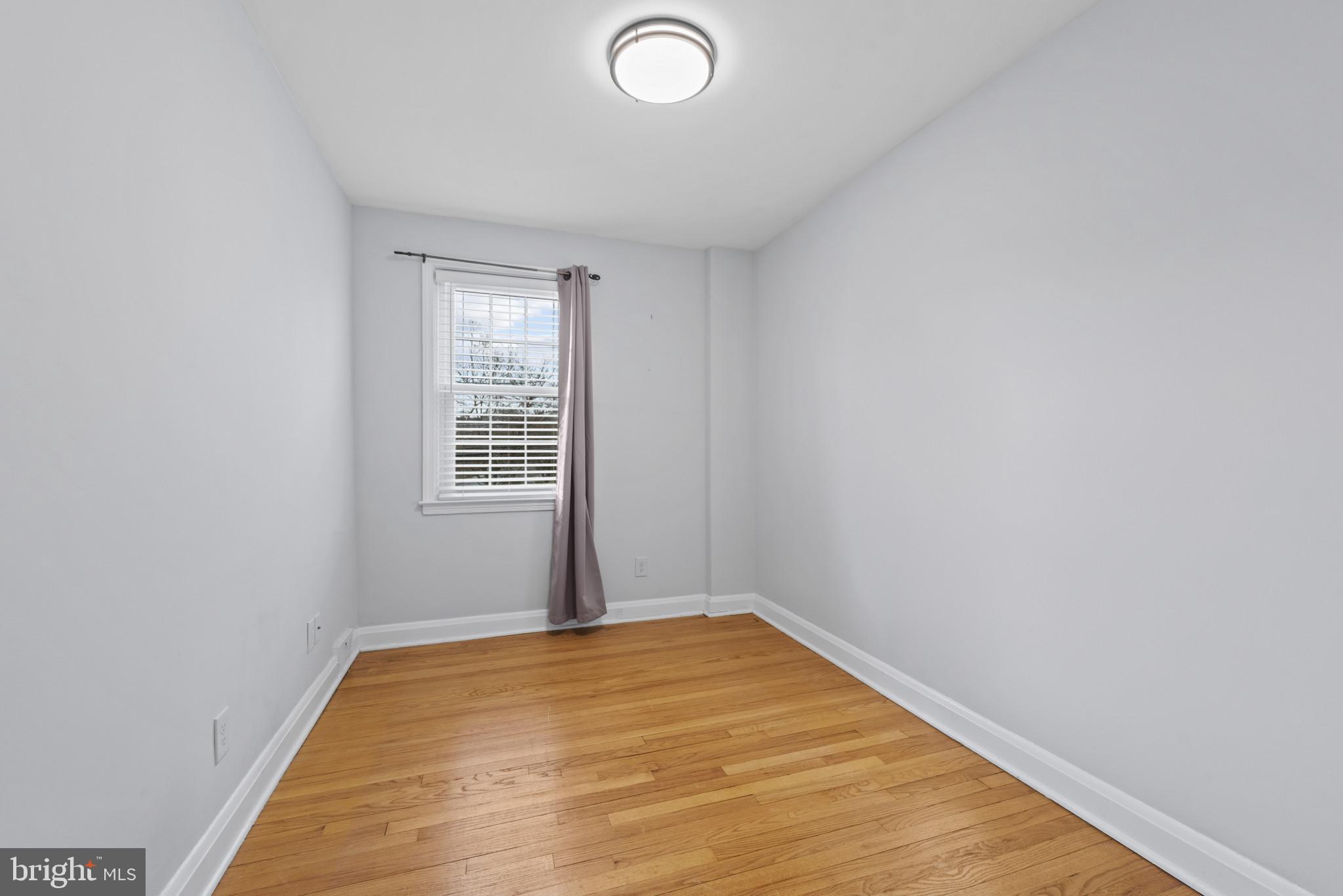169 Regester Avenue Baltimore, MD 21212 - Photo 17 of 30 Bright and airy space with hardwood floors.