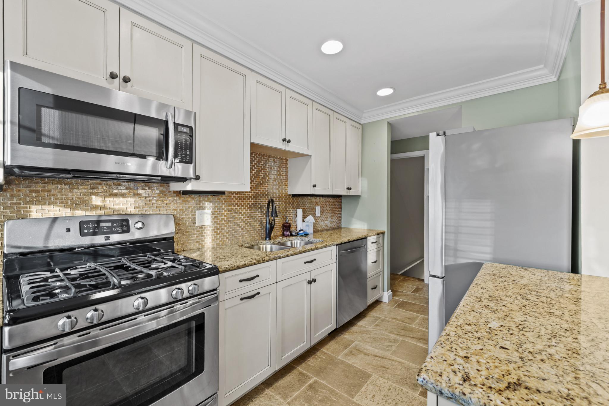 169 Regester Avenue Baltimore, MD 21212 - Photo 3 of 30 Modern kitchen with sleek finishes.