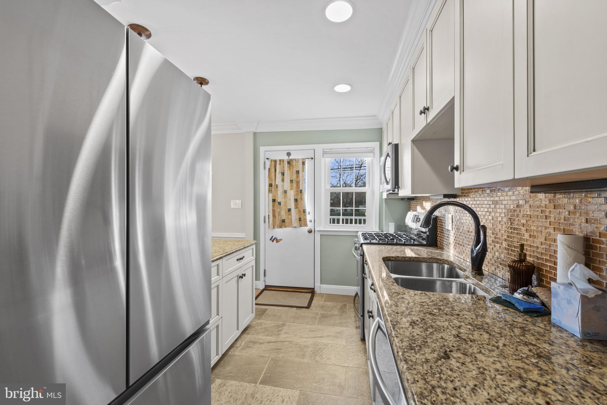 169 Regester Avenue Baltimore, MD 21212 - Photo 5 of 30 Modern kitchen with sleek finishes.