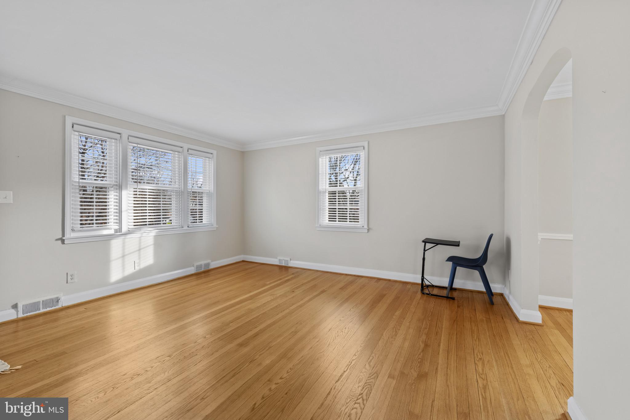 169 Regester Avenue Baltimore, MD 21212 - Photo 9 of 30 Bright and airy space with warm wood floors.
