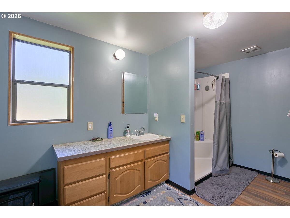 61216 Old Ski Run Road Joseph, OR 97846 - Photo 11 of 27 a bathroom with a sink mirror and a shower