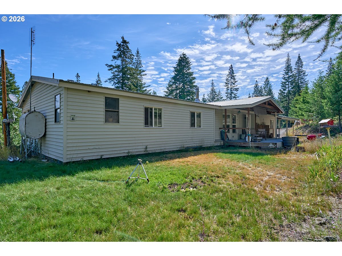 61216 Old Ski Run Road Joseph, OR 97846 - Photo 17 of 27 a view of a house with backyard and sitting area