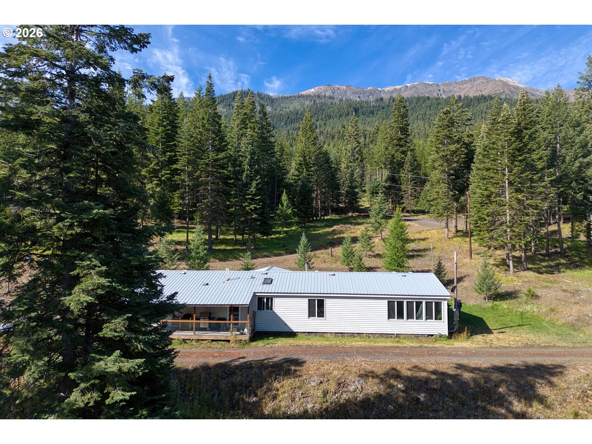 61216 Old Ski Run Road Joseph, OR 97846 - Photo 2 of 27 a view of house with outdoor space and backyard