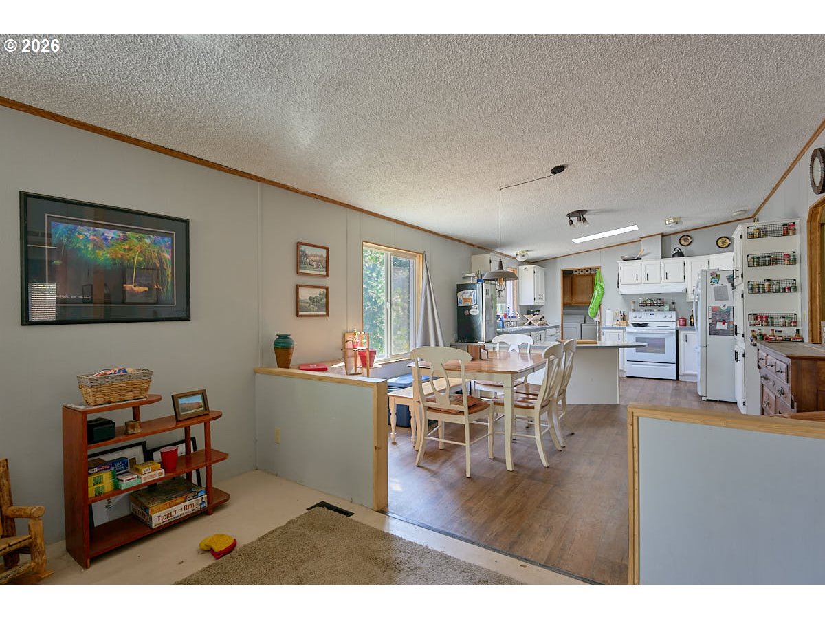 61216 Old Ski Run Road Joseph, OR 97846 - Photo 7 of 27 a living room with lots of furniture and kitchen view