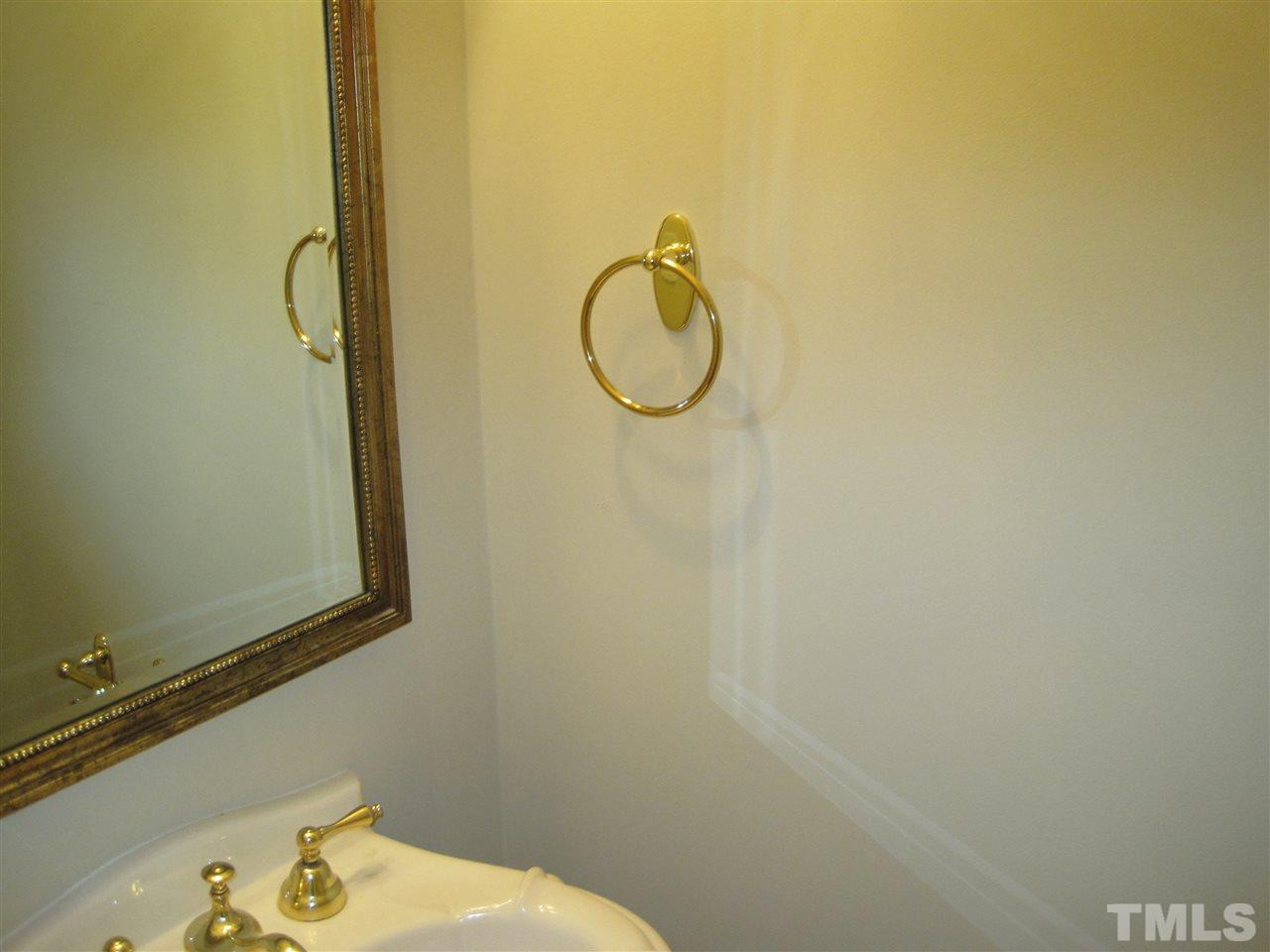 9904 Bright Hedge Court Raleigh, NC 27613 - Photo 11 of 20 a bathroom with a granite countertop sink and a mirror